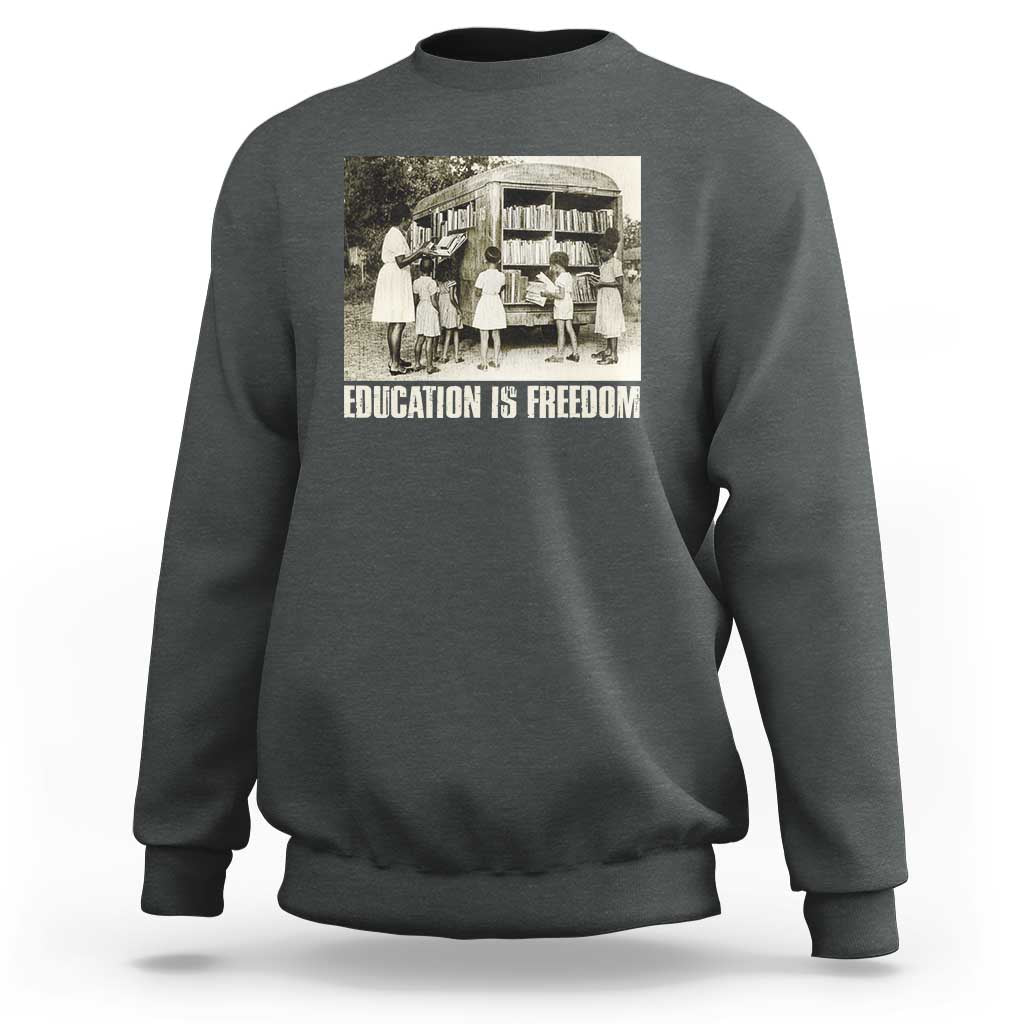 Dark heather gray sweatshirt with 'EDUCATION IS FREEDOM' front graphic, crewneck