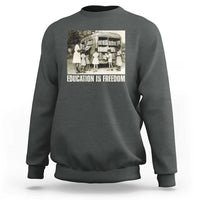 Dark heather gray sweatshirt with 'EDUCATION IS FREEDOM' front graphic, crewneck