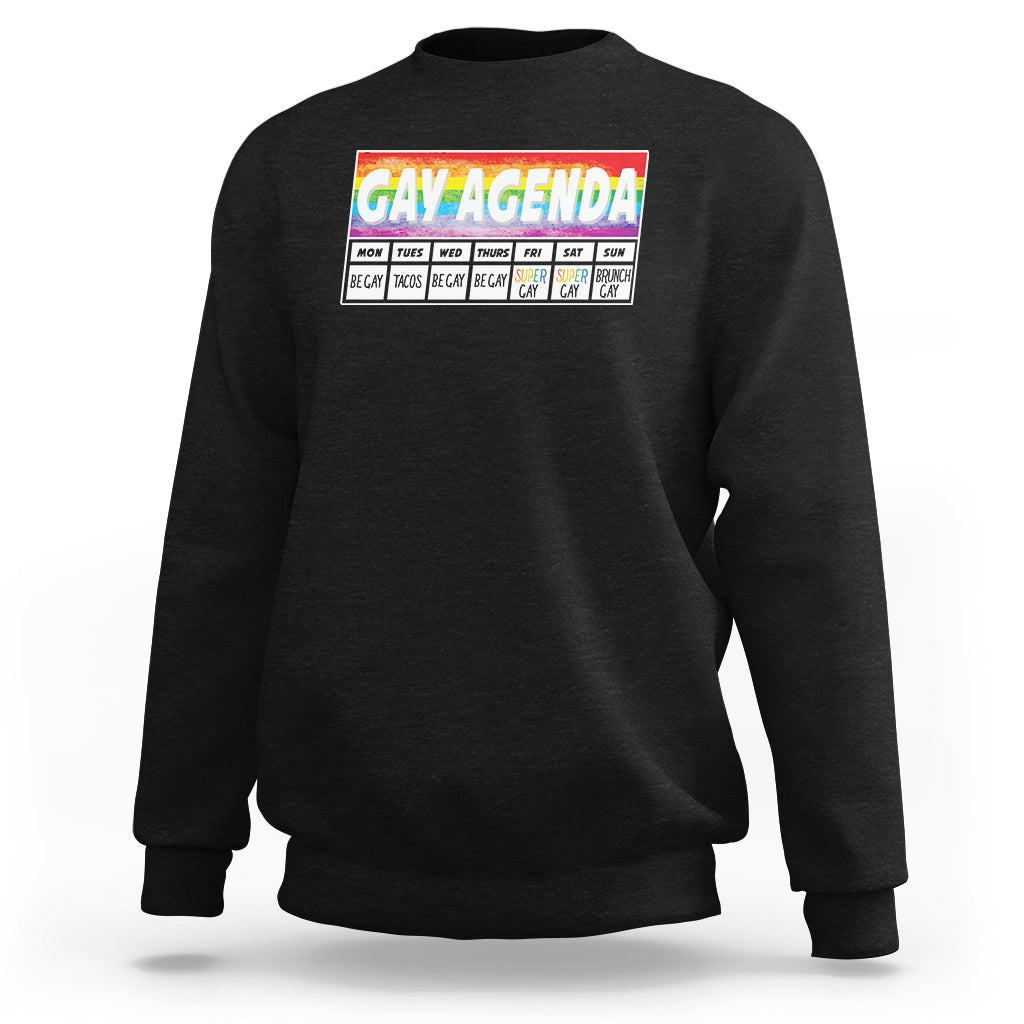 Black crewneck sweatshirt with “GAY AGENDA” weekly schedule graphic on chest