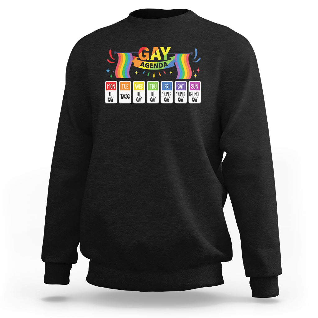 Black sweatshirt with rainbow “GAY AGENDA” weekly schedule graphic