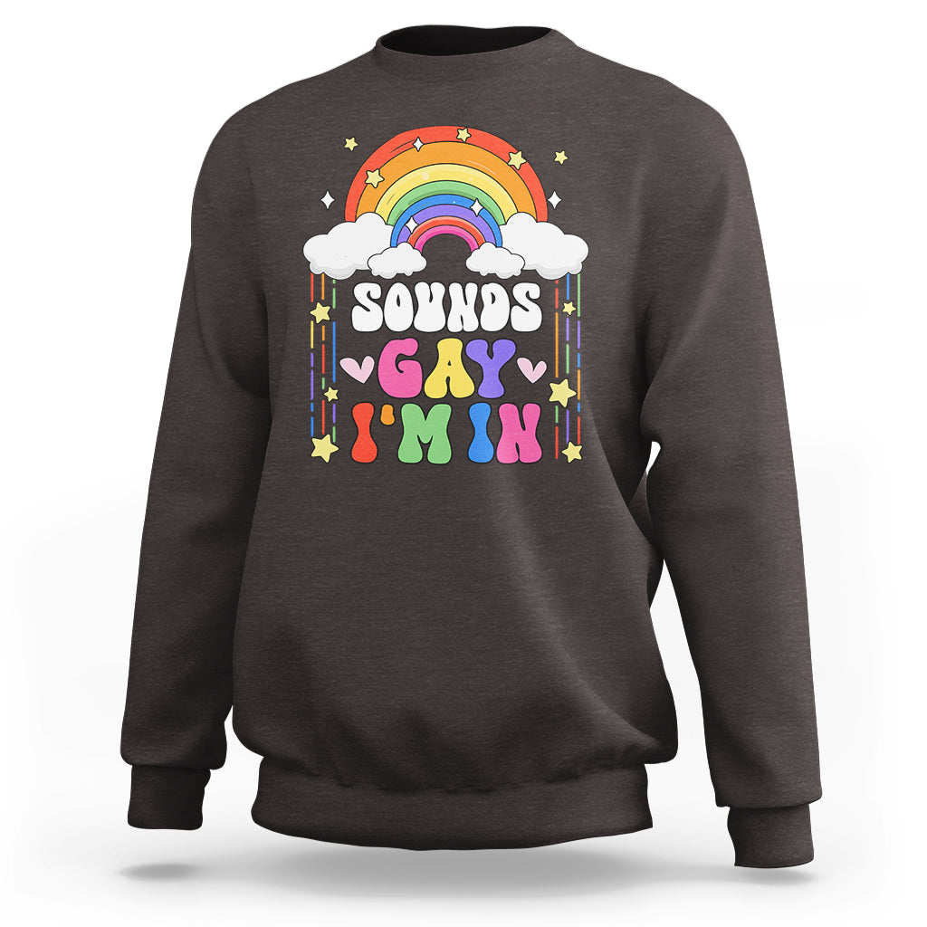 Charcoal crewneck sweatshirt with rainbow arch and “Sounds Gay” graphic