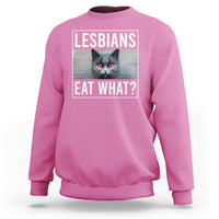 Pink crewneck sweatshirt with cat graphic and text 'LESBIANS EAT WHAT?' on chest