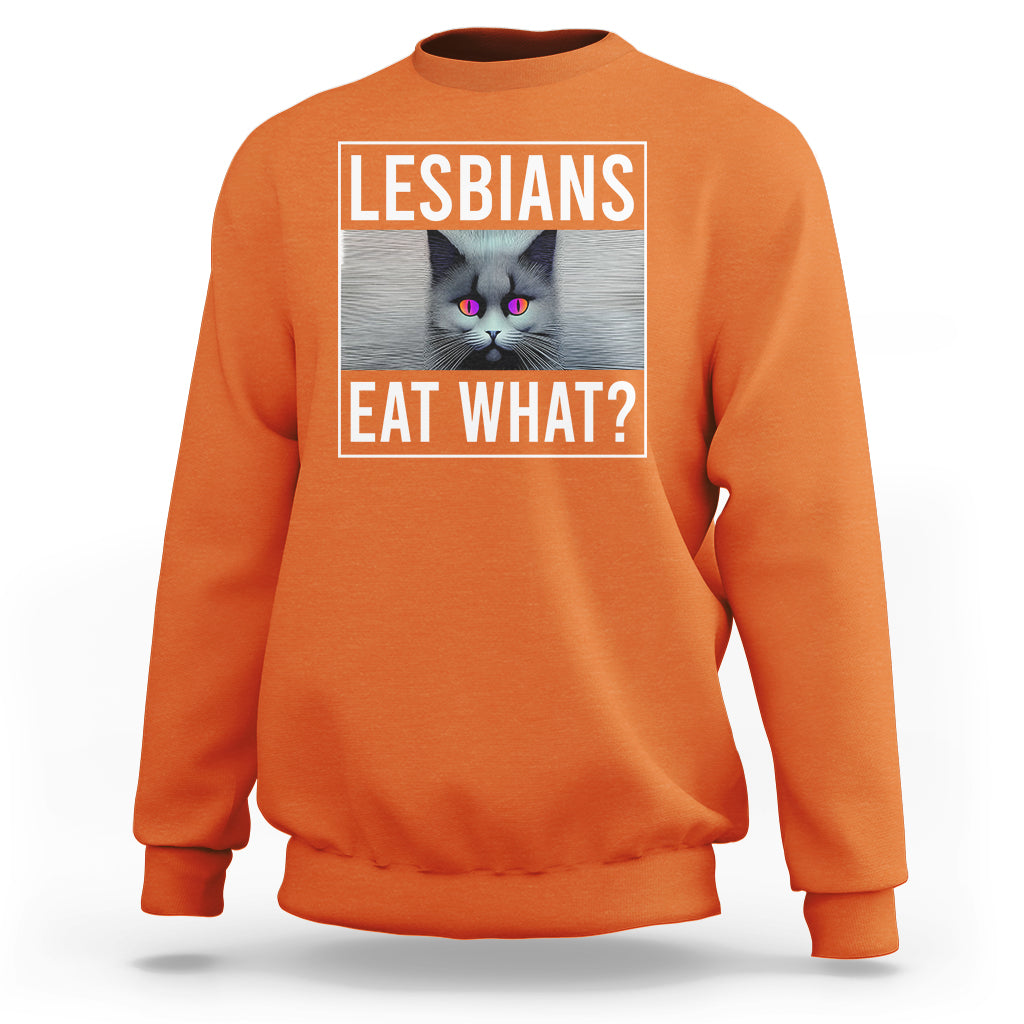 Orange crewneck sweatshirt with cat graphic and text 'LESBIANS EAT WHAT?' on chest