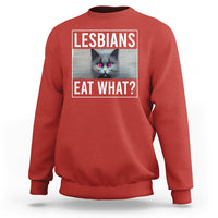 Red crewneck sweatshirt with cat graphic and text 'LESBIANS EAT WHAT?' on chest