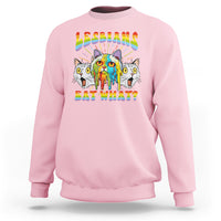 Light pink crewneck sweatshirt with rainbow "Lesbians Eat What?" cat graphic