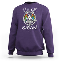 Purple sweatshirt with 'Hail Gay Satan' text and colorful winged graphic on chest