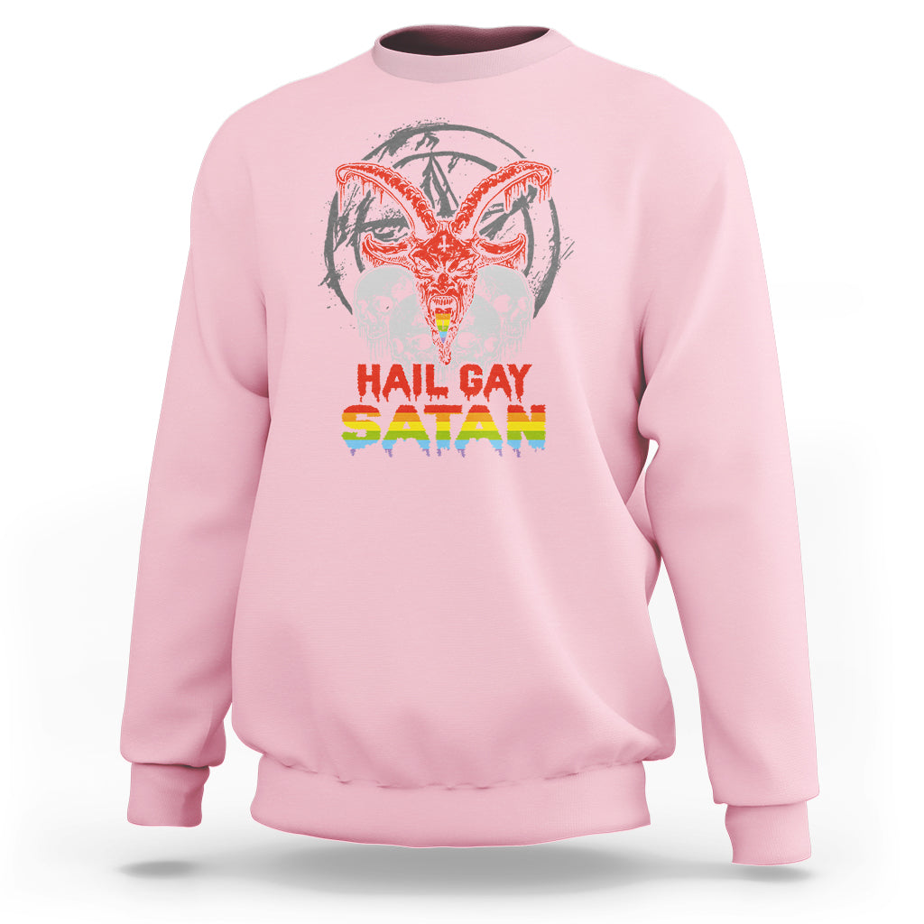 Light pink crewneck sweatshirt with skull and red/orange winged demon graphic
