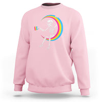 Light pink crewneck sweatshirt with skeleton drinking coffee graphic and rainbow arc print