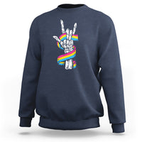 Navy sweatshirt with skeleton rock hand graphic and pride rainbow flag colors on back