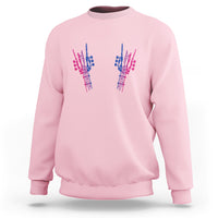 Light pink crewneck sweatshirt with colorful hand graphic on chest