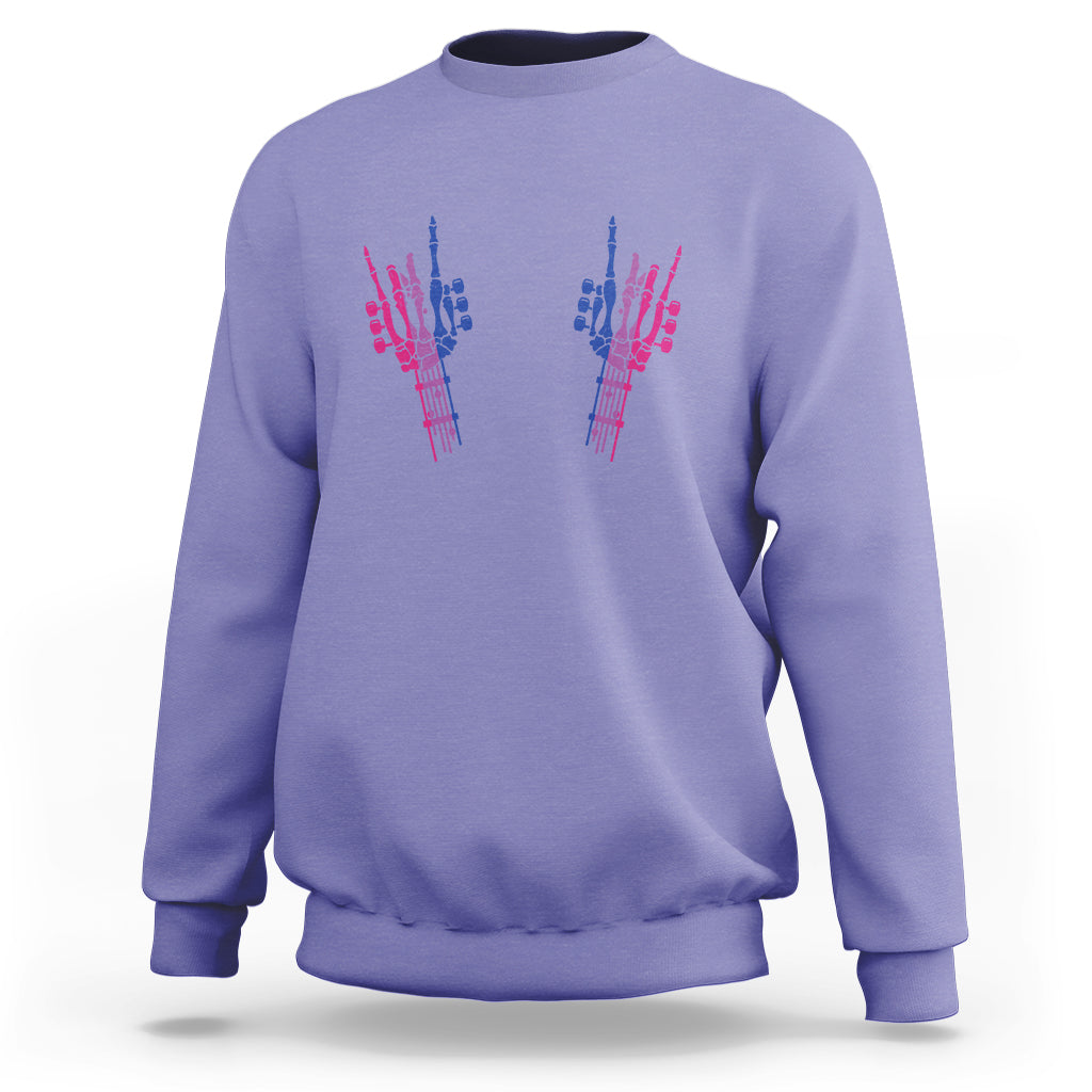 Violet crewneck sweatshirt with colorful hand graphic on chest
