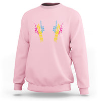 Light pink sweatshirt with colorful skeletal rock hand graphic on back