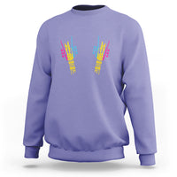 Violet sweatshirt with colorful skeletal rock hand graphic on back