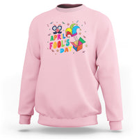Light pink April Fool’s Day jester sweatshirt with colorful “April Fool’s Day” graphic