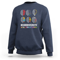 Navy crewneck sweatshirt with multicolor brain icons and “We All Think Differently”