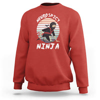 Red crewneck sweatshirt with “Neurospicy Ninja” graphic on chest