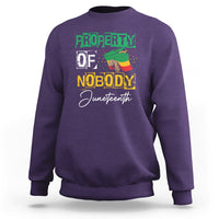 Dark forest green Juneteenth sweatshirt with front graphic text "PROPERTY OF NOBODY"
