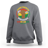 Charcoal crewneck sweatshirt with Juneteenth “Breaking Every Chain” chest graphic