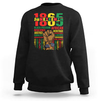Black Juneteenth sweatshirt with colorful 'Juneteenth' graphic and raised-fist portrait