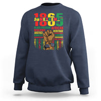 Navy Juneteenth sweatshirt with colorful 'Juneteenth' graphic and raised-fist portrait