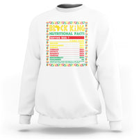 White crewneck sweatshirt with colorful 'Black King Nutritional Facts' chest print