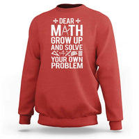 Red sweatshirt with 'DEAR MATH' graphic, crew neck and long sleeves.
