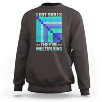 Charcoal crewneck sweatshirt with colorful math skills graphic on front