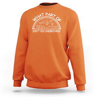 Orange sweatshirt with white math quote graphic across chest