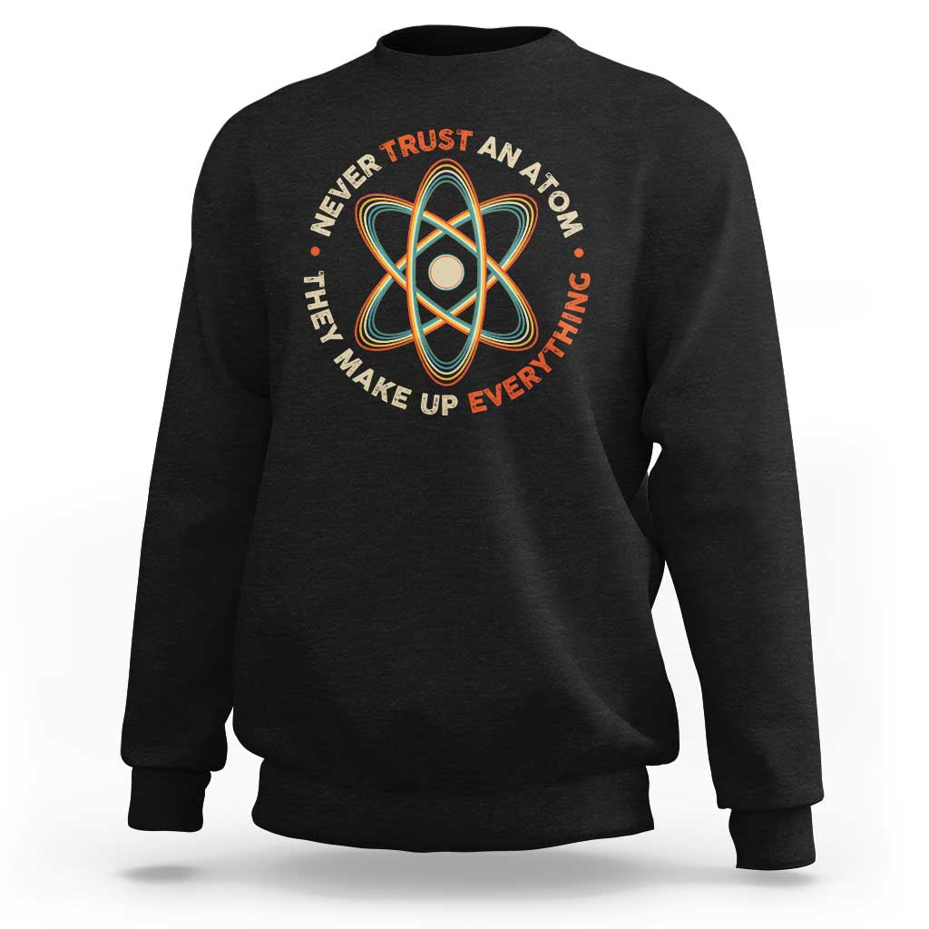 Black science sweatshirt with colorful atom graphic and slogan on front