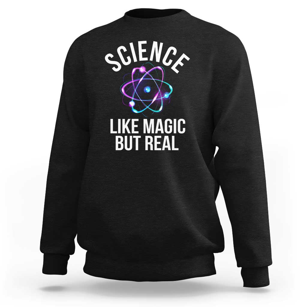 Black sweatshirt with front graphic: “SCIENCE LIKE MAGIC BUT REAL” and atom icon