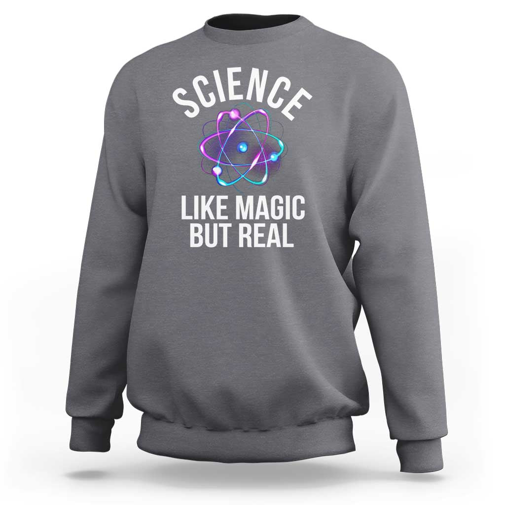 Gray sweatshirt with front graphic: “SCIENCE LIKE MAGIC BUT REAL” and atom icon