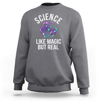 Gray sweatshirt with front graphic: “SCIENCE LIKE MAGIC BUT REAL” and atom icon