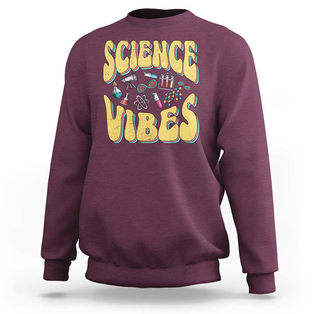 Maroon crewneck sweatshirt with “SCIENCE VIBES” science-themed graphic on chest