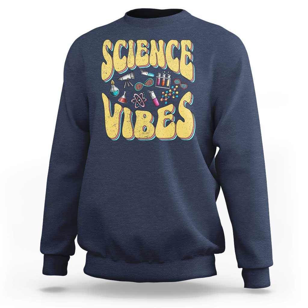 Heathered blue crewneck sweatshirt with “SCIENCE VIBES” science-themed graphic