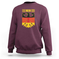 Maroon crewneck sweatshirt with large German flag-style “Nein” graphic on front