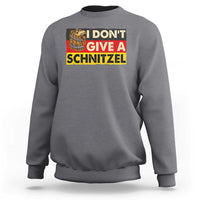 Charcoal crewneck sweatshirt with "I DON'T GIVE A SCHNITZEL" graphic and beer mug