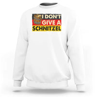 White crewneck sweatshirt with "I DON'T GIVE A SCHNITZEL" graphic and beer mug