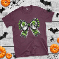 Maroon Halloween t-shirt with green skull bow graphic on the front
