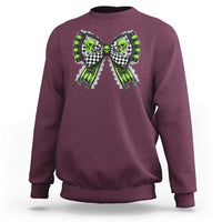Maroon Halloween sweatshirt with skull bows graphic on chest