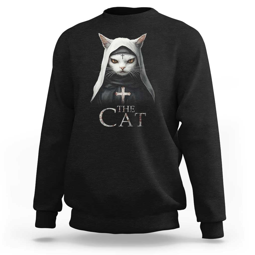 Black sweatshirt with front cat nun graphic and “The Cat” text