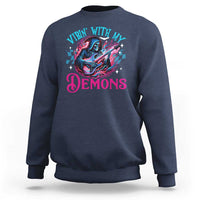 Navy crewneck sweatshirt with long sleeves and colorful 'Vibin With My Demons' graphic