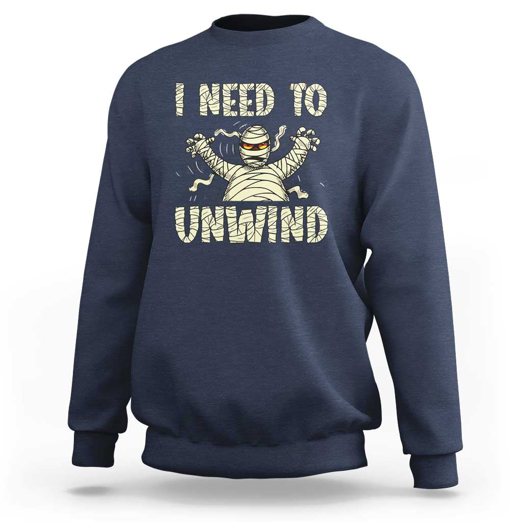 Navy Halloween mummy sweatshirt with 'I need to unwind' graphic on chest