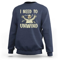 Navy Halloween mummy sweatshirt with 'I need to unwind' graphic on chest