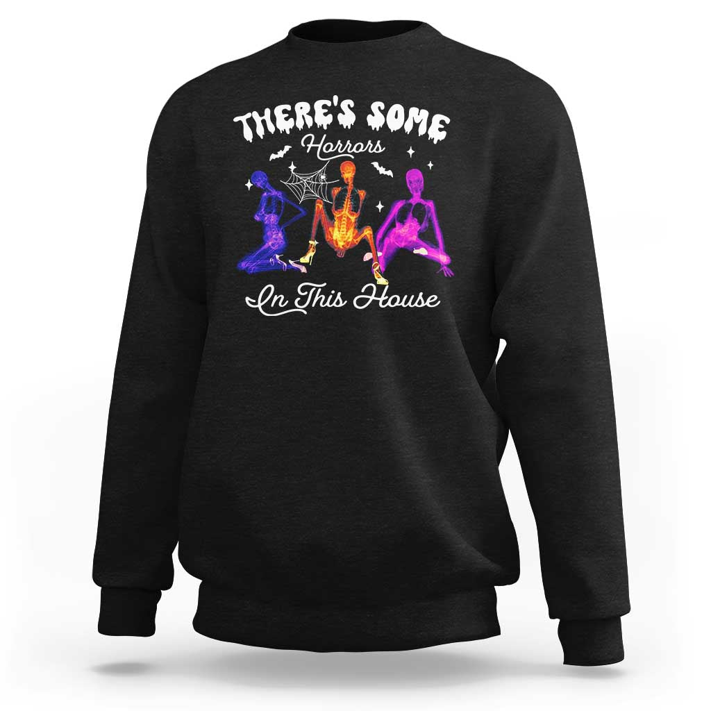 Black Halloween sweatshirt with glowing horror house graphic on the front