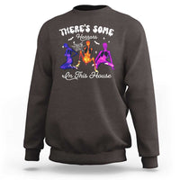 Dark chocolate Halloween sweatshirt with glowing horror house graphic on the front