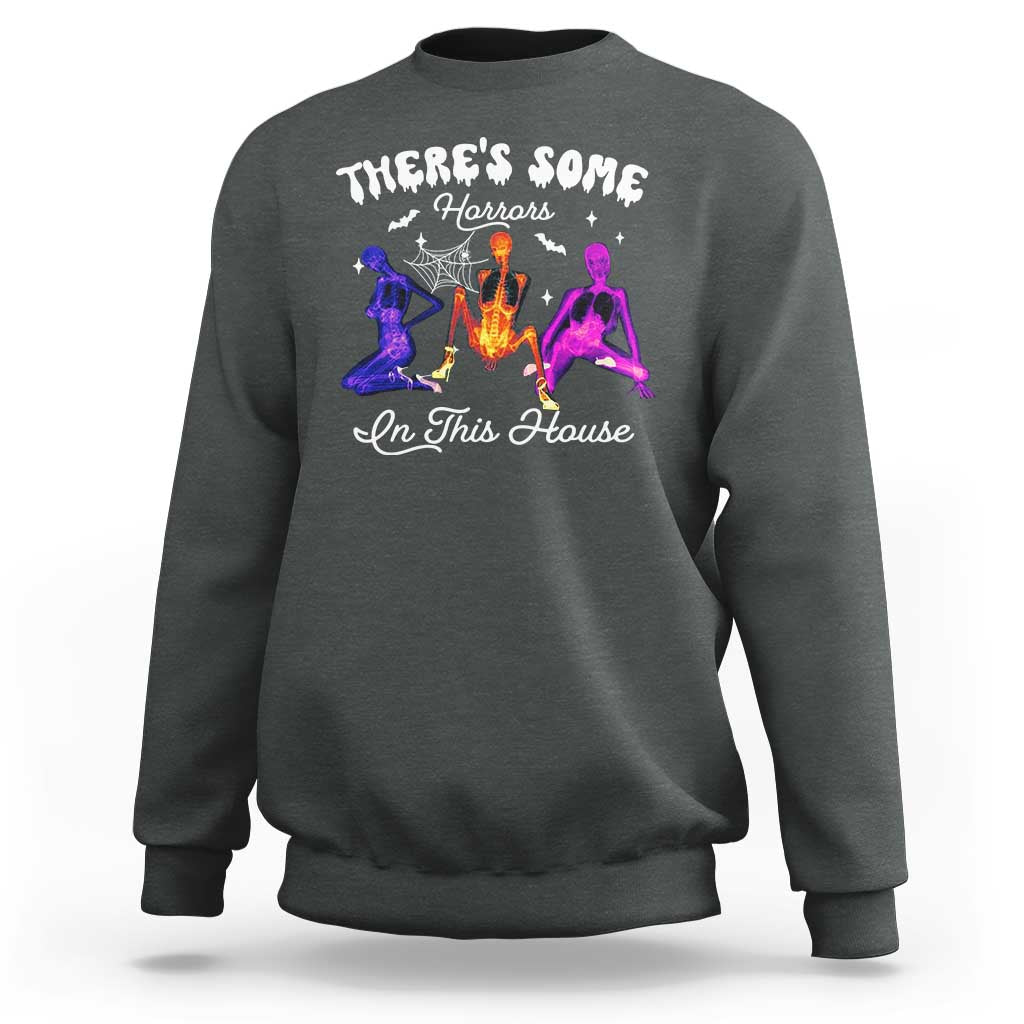 Dark heather Halloween sweatshirt with glowing horror house graphic on the front