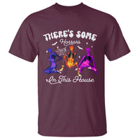 Maroon Halloween graphic t-shirt with haunted house and witch silhouettes