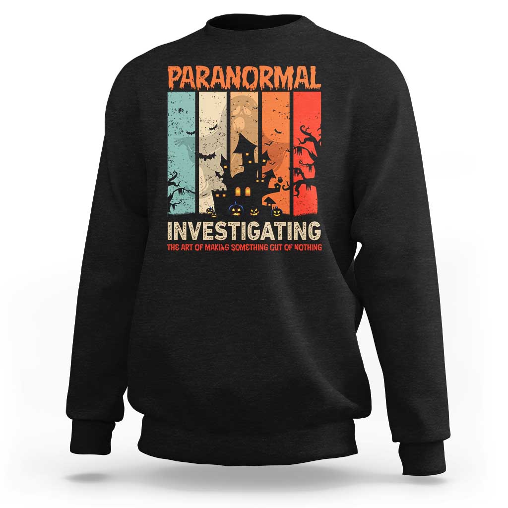 Black crewneck sweatshirt with colorful "Paranormal Investigating" back graphic