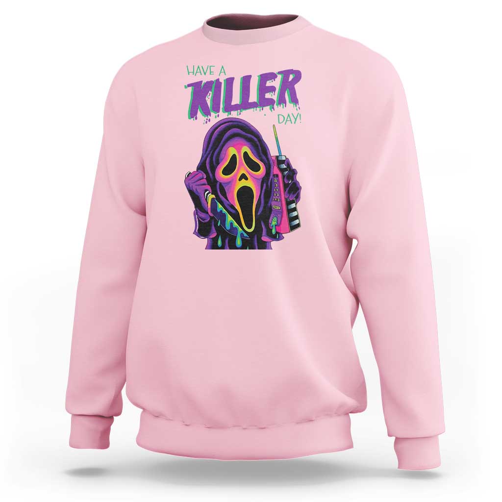 Light pink Halloween sweatshirt with neon skull "Have a Killer Day" graphic