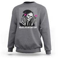 Charcoal gray crewneck sweatshirt with grim reaper graphic and “Relax, It’s My Day Off” text